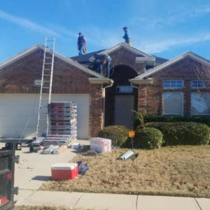 roofers working on house